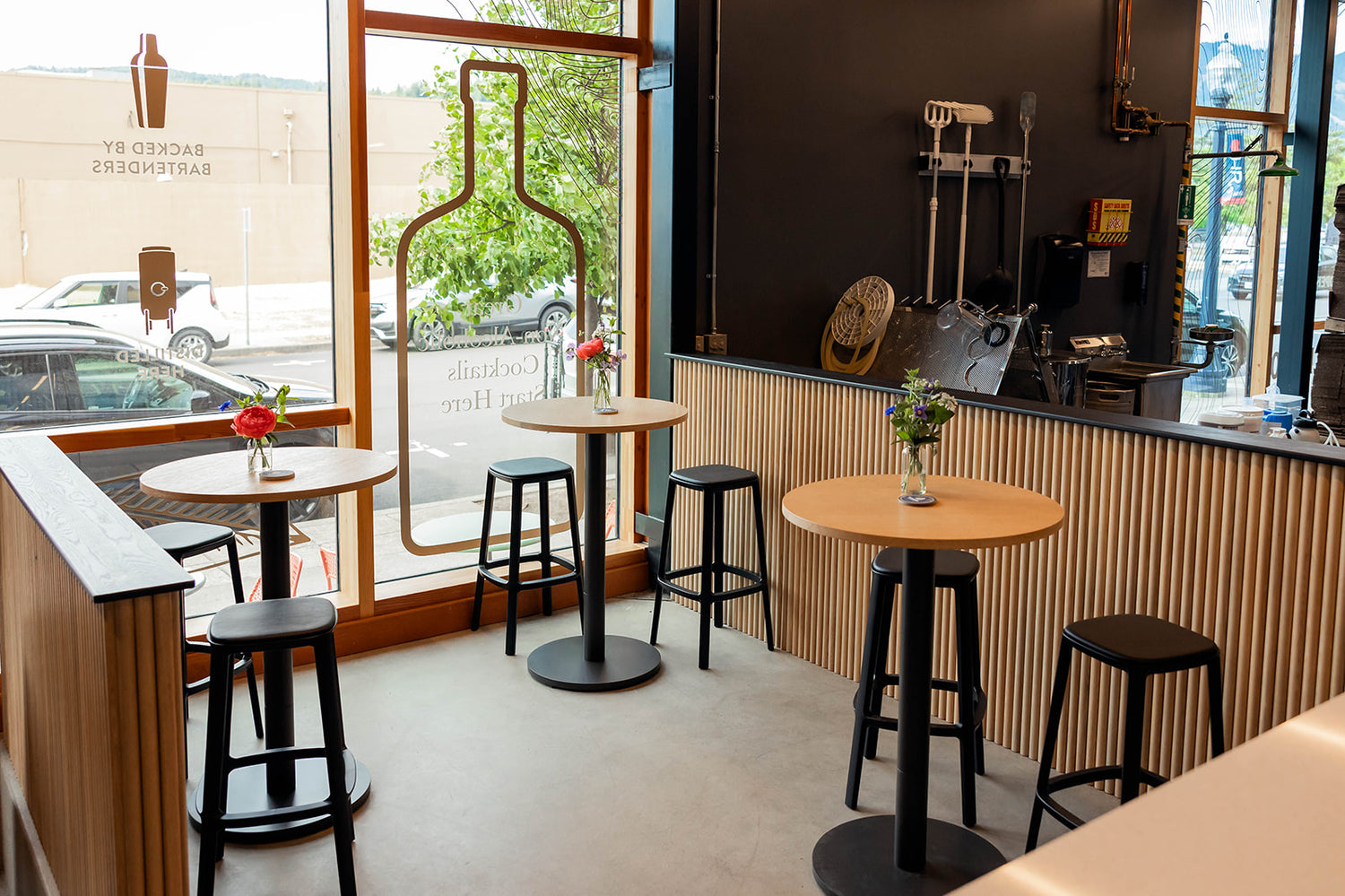 3 small high tables in the tasting room