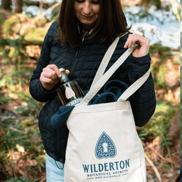 woman pulling a bottle of earthen from the wilderton tote